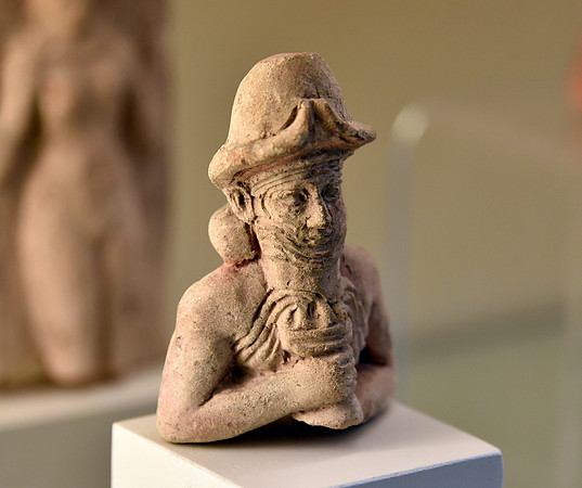 God Ea, also Enki, holding a cup with overflowing water. From Iraq. Pergamon Museum