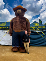 Posing with Smokey Bear at the Great American State Fair