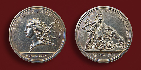 1783 Libertas Americana medal, initiated and designed by Benjamin Franklin, honors the American Revolution and depicts the goddess of Liberty carrying a Phrygian cap