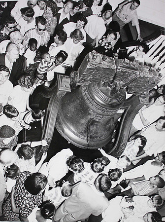 A crowd gathers around the Liberty Bell in Independence Hall, July 3, 1951 (photo by Abbie Rowe, photographer for the National Park Service)