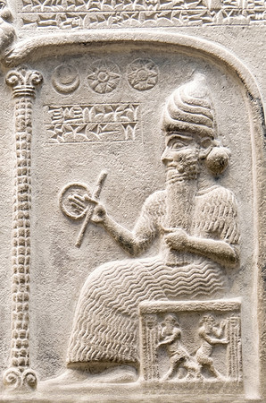 Representation of Shamash from the Tablet of Shamash, showing him sitting on his throne dispensing justice while clutching a rod-and-ring symbol (circa 888-855 BC) (AI enhanced)