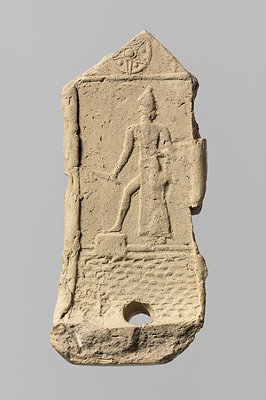 Part of a model chariot, with an impression of the sun god Shamash rising over the mountains (Babylonian circa 2000-1600 BCE)